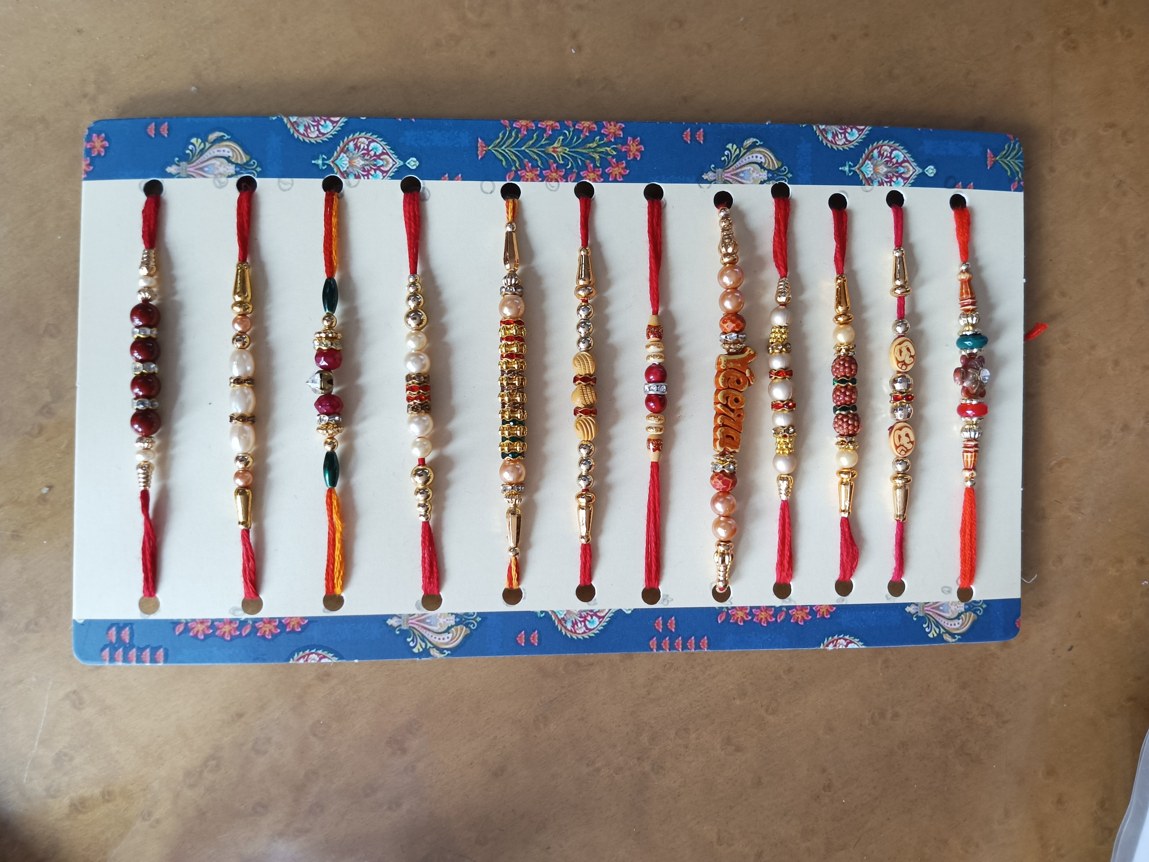 Set of 12 Different Rakhis in a card H12